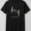 Key Change Sheet Music unisex t-shirt in black with music staff with two treble clefs and a key change