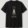 Late Set Midnight Spotlight unisex t-shirt in black with clock near midnight casting a spotlight beam